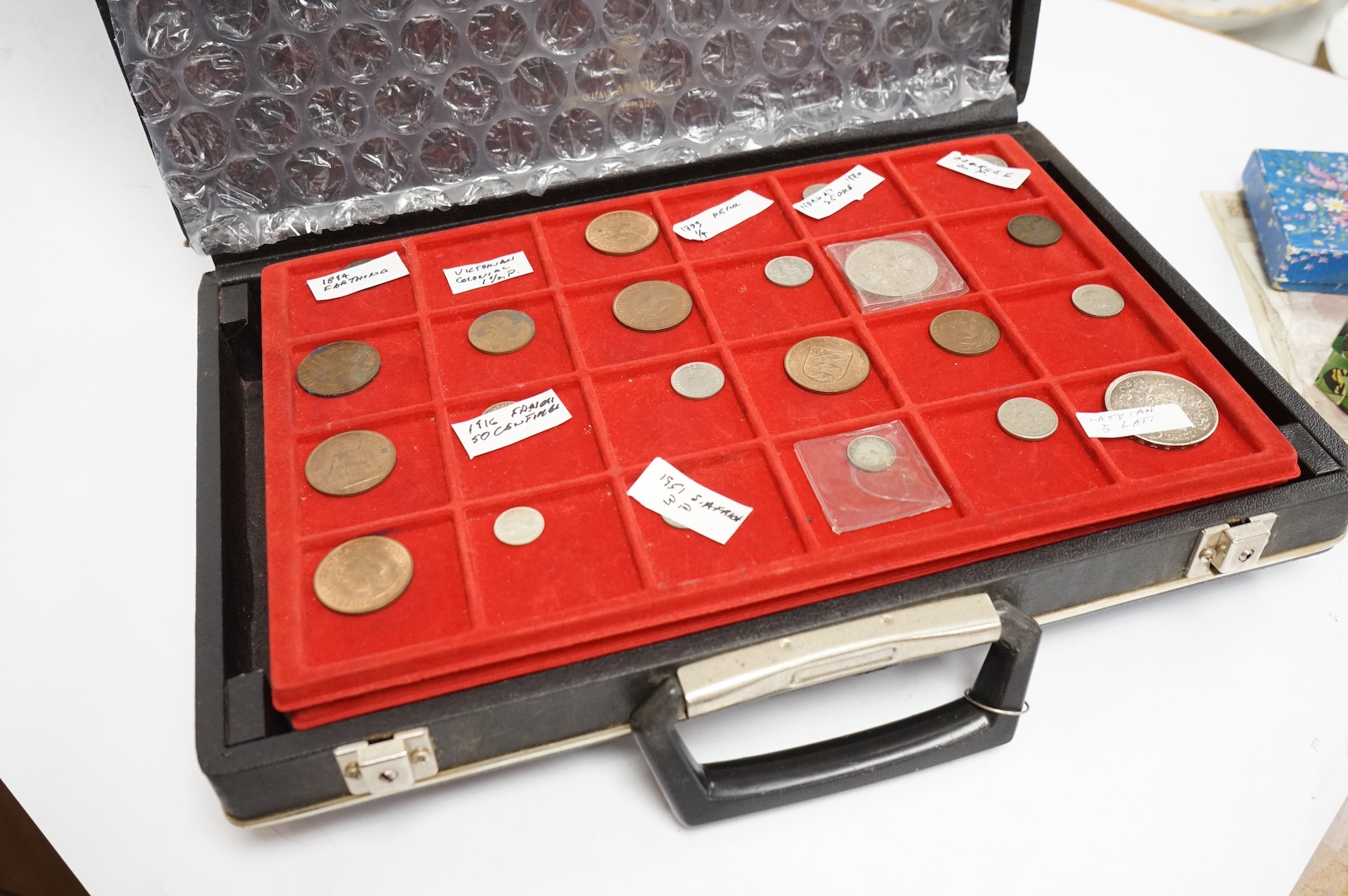 British and world coins and banknotes, including Victoria, double florin 1887, about EF, Latvia 5 silver Lati, 1931, about EF, QE2 silver crown, Victoria to George V florins, shillings etc. France 10 francs 1965 and John